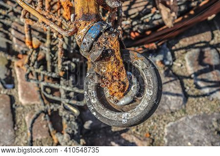 Rusty And Damaged Shopping Cart Found In The Port Of Kiel In Germany
