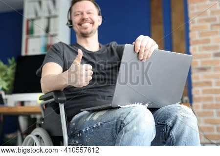 Disabled Man Works Remotely In Call Center. Remote Professions For People With Disabilities Concept