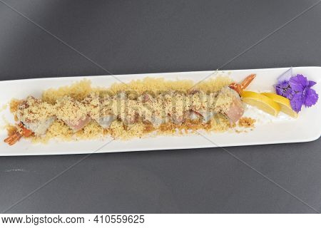Overhead View Of Albacore Truffle Sushi Topped With Cruncy Tempura With Beautiful Presentation On Pl