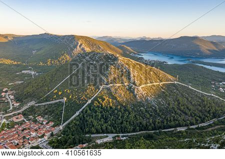 Aerial Drone Shot Of Ston City Wall Over Hill In Ragusa Region Near Dubrovnik In Croatia Summer Sunr