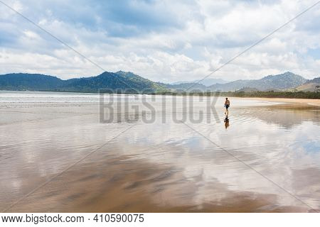Retired Man Enjoy Beautiful View Of Tropical Sand Beach, Sea Surf. Red Island Beach, Pantai Pulau Me
