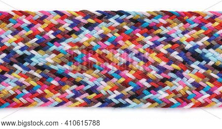 A Braid Of Multi Colored Sewing Threads On A White Background