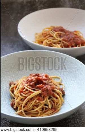 Two Deep Plates With Hot Pasta, Spaghetti Pasta With Meat And Tomato Sauce, Spaghetti Ragus, Meat Bo