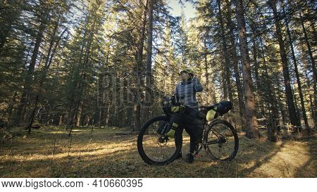 The Woman Travel On Mixed Terrain Cycle Touring With Bike Bikepacking. The Traveler Journey With Bic