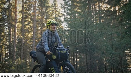 The Woman Travel On Mixed Terrain Cycle Touring With Bike Bikepacking. The Traveler Journey With Bic