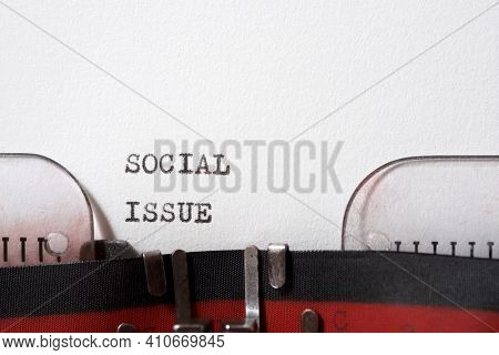 Social issue phrase written with a typewriter.