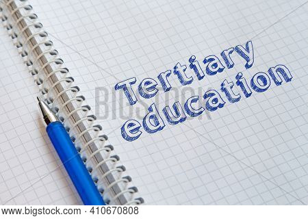 Text Tertiary Education Handwritten On Sheet Of Notebook