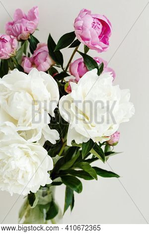 Simple Sloopy Flower Bouquet Of Pink And White Peonies Flowers Over Pastel Background, Spring And Su