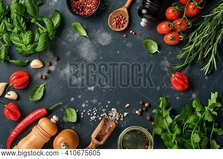 Food Cooking Background. Fresh Rosemary, Cilantro, Basil, Cherry Tomatoes, Peppers And Olive Oil, Sp