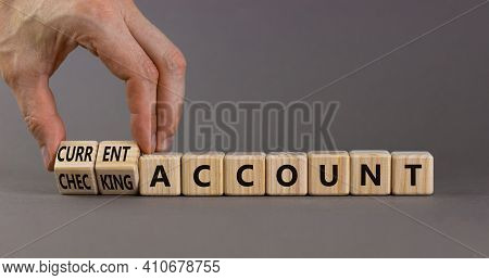 Current Or Checking Account Symbol. Businessman Turns Wooden Cubes And Changes Words 'checking Accou