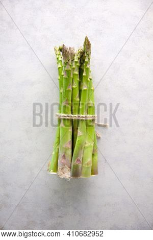 Bunch Of Asparagus Tied With Jute Rope On Whtie Background.
