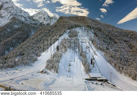 Aerial View Of Ski Jump In Planica, Slovenia At Ratece Near Kranjska Gora In Winter With Snow.