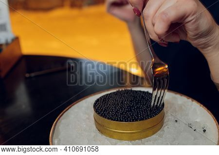 Paddlefish Black Caviar In A Plastic Plate, Gourmet And Delicious Food, Close Up.