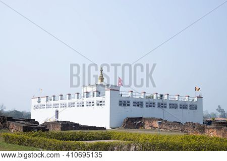 Lumbini, Nepal - February 23 2021: Holy Maya Devi Temple In Lumbini, Nepal. Sacred Pilgrimage Site F