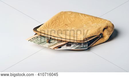 Yellow Old Wallet With A Fragment Of Ten Dollars Bill And Credit Card On Grey Background, Social Pen