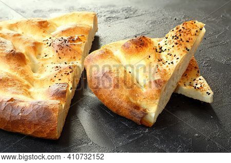 Slices Of Ramadan Pita (ramazan Pidesi) Traditional Turkish Bread For Holy Month Ramadan On Black Ba