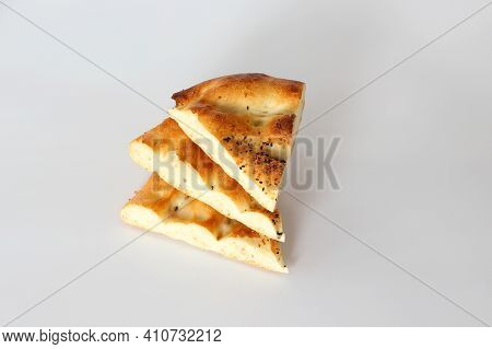 Slices Of Ramadan Pita (ramazan Pidesi) Traditional Turkish Bread For Holy Month Ramadan On White Ba