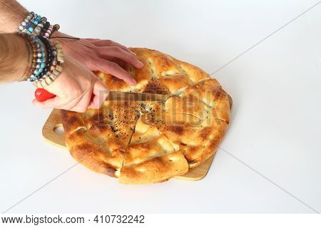 Slices Of Ramadan Pita (ramazan Pidesi) Traditional Turkish Bread For Holy Month Ramadan On White Ba