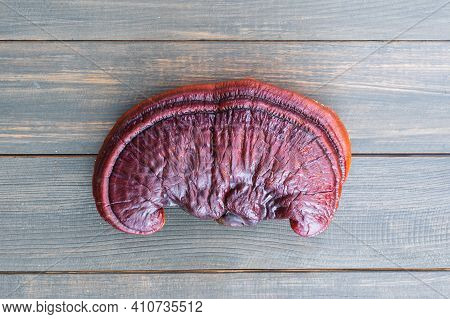 Close Up Of Ling Zhi Mushroom On Wood Table