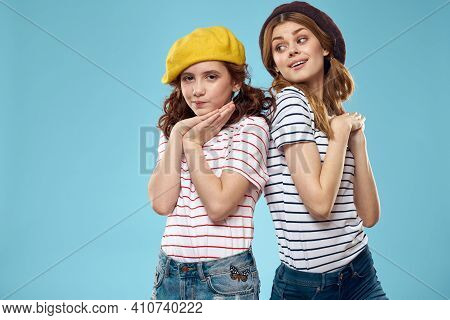 Mom And Daughter Striped T-shirts Hugs Fun Lifestyle Blue Background
