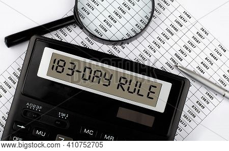 Calculator With Text 183 Day Rule On Chart. Business, Finance Conceptual.