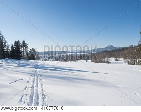 Winter Landscape With View Of Village Town Cvikov And Ski Run Trail On Snow-covered Fields And Snowy