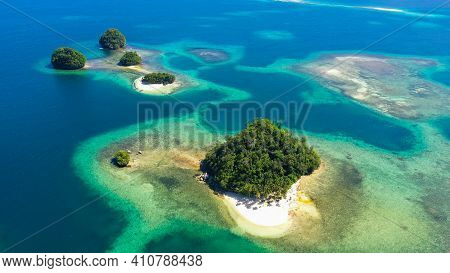 Aerial View Of Tropical Island With Sand Beach, Palm Trees By Atoll With Coral Reef. Britania Island