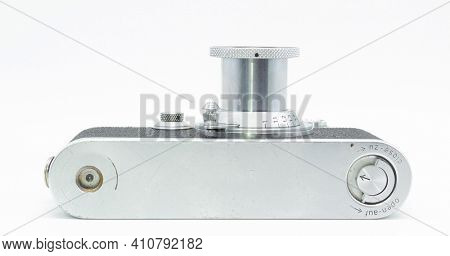 DUSSELDORF, GERMANY - FEBRUARY, 2021: Bottom view of famous 35mm film camera Leica IIIc isolated on white background