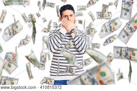 Young hispanic man wearing casual clothes shocked covering mouth with hands for mistake. secret concept.