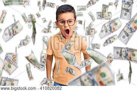 Little cute boy kid wearing casual clothes and glasses scared and amazed with open mouth for surprise, disbelief face