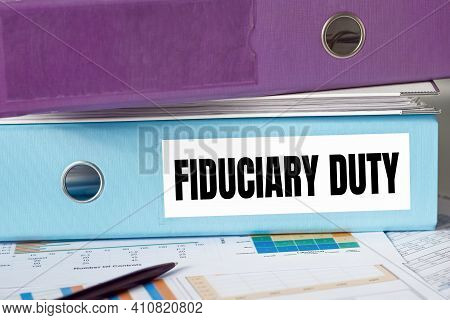 A Lignt Blue Folder With The Label Fiduciary Daty.
