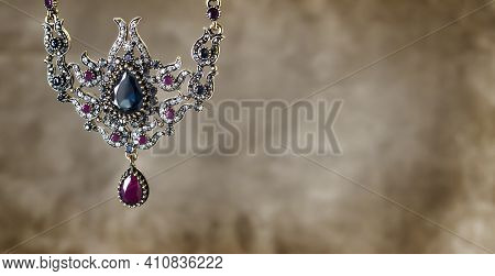 Antique Necklace On A Velor Background. Feminine Decoration.