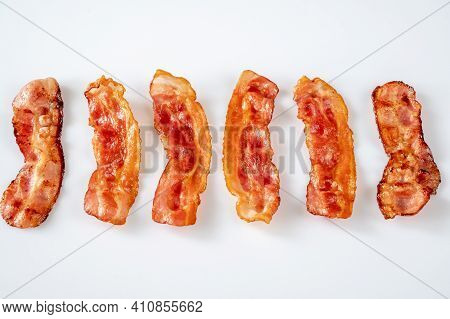 Fried Bacon Strips On The White Background