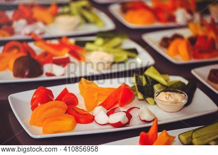 Fresh Vegetable Salad With Radish, Cucumber, Bell Pepper, Tomatoes And Herbs In A Ceramic Bowl Resta