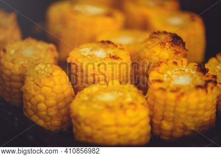Grilled Corn On The Cob With Oil And Salt On The Grill Rack, Close-up