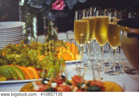 Buffet. The Dining Room Is Full Of Glasses Of Sparkling White Wine With Canapes And Antipasti In The