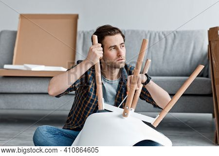 Profession, Occupation, Home Furniture Assembly And New Ordering. Pensive Millennial Handsome Man Sc