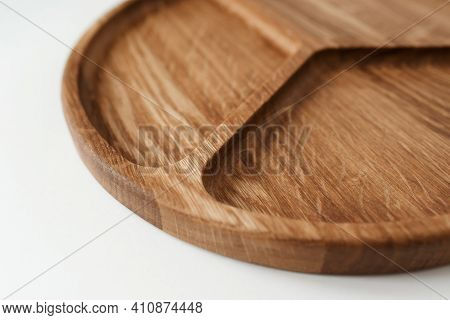 Compartmental Dish On White Background In Close-up. Dishes Made Of Natural Materials.