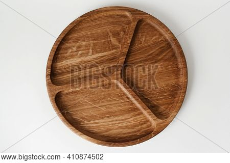 Compartmental Dish On White Background Top View. Wooden Bowl. Wooden Dish On White Background. Woode