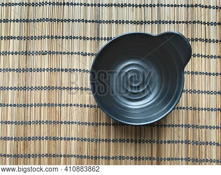 Wooden Napkin With Black Cup. View From Above.