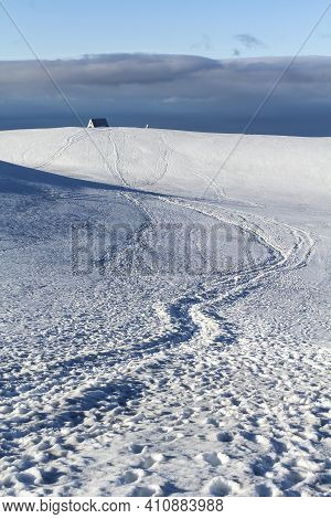 Footprints In The Snowy Landscape At Fimmvoerduhals Hiking Trail In The Very Early Morning, Highland