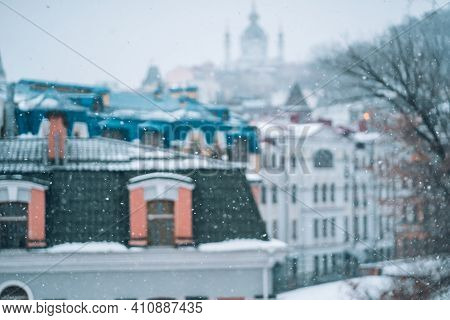 Copious Snowfall Over The City With The Roofs