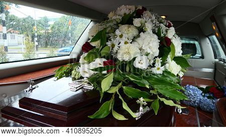 Closeup Shot Of A Funeral Casket Or Coffin In A Hearse Or Chapel Or Burial At Cemetery