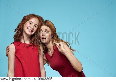 Family Mom And Daughter Hug Red Dresses Communication Emotions Blue Background