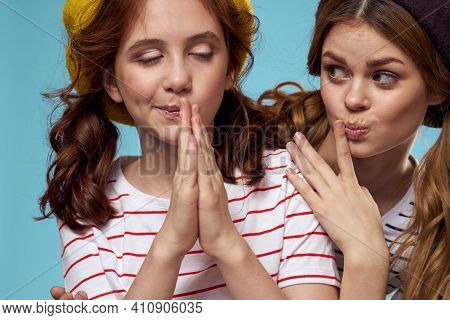 Mom And Daughter Striped T-shirts Hugs Fun Lifestyle Blue Background