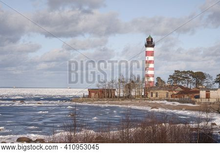 The Old Shepelevsky Lighthouse On The Shores Of The Baltic Sea On A Sunny Day In Early Spring.