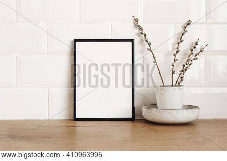 Spring Still Life. Blank Black Picture Frame Mockup On Wooden Table Background. Easter Composition W