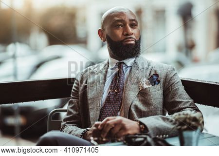 Portrait Of A Dapper Mature Hairless Black Man Entrepreneur With A Nice Beard, In A Custom Elegant G