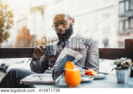 Portrait Of A Baldheaded Adult Black Dandy Guy With A Well-groomed Beard, In A Custom Made Elegant C