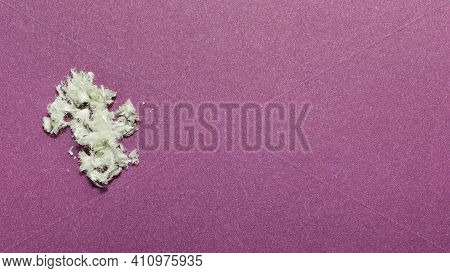 Hazardous Mineral Asbestos Close-up On A Fiolet Background. Copy Space